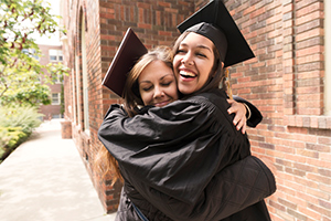 life event - graduate hugging mother