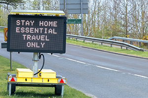 stay home traffic sign on side of road