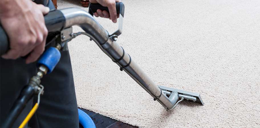 Man cleaning carpet-Business Insurance Claims