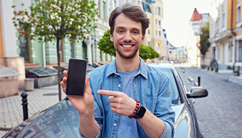 man showing app on phone